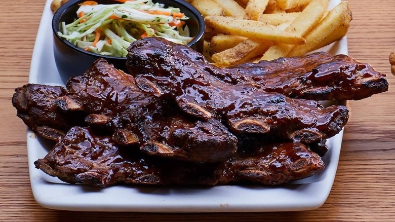 Riblets on plate with fries and coleslaw