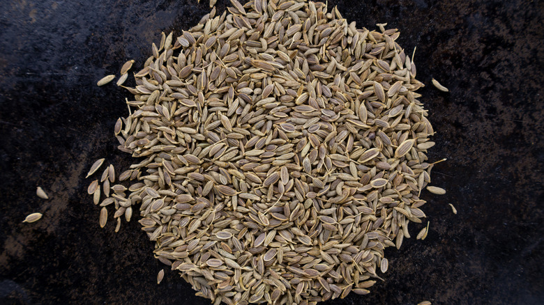 Cumin seeds in black pan