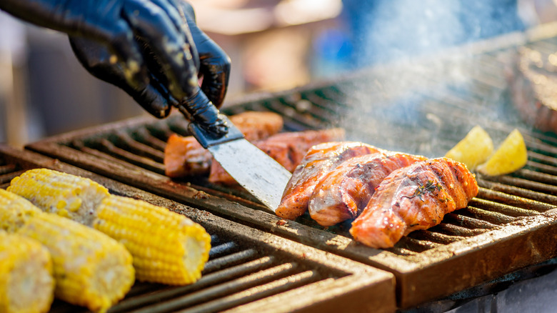 flipping salmon fillets on grill