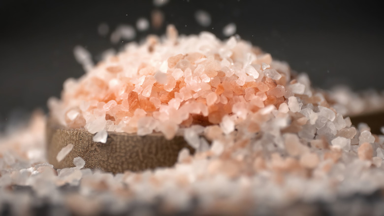Close up of wooden bowl containig Himalayan salt
