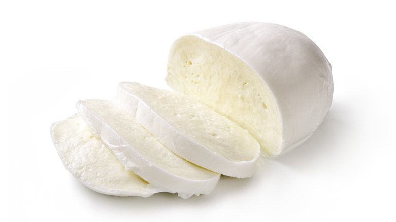 Sliced mozzarella cheese on white background