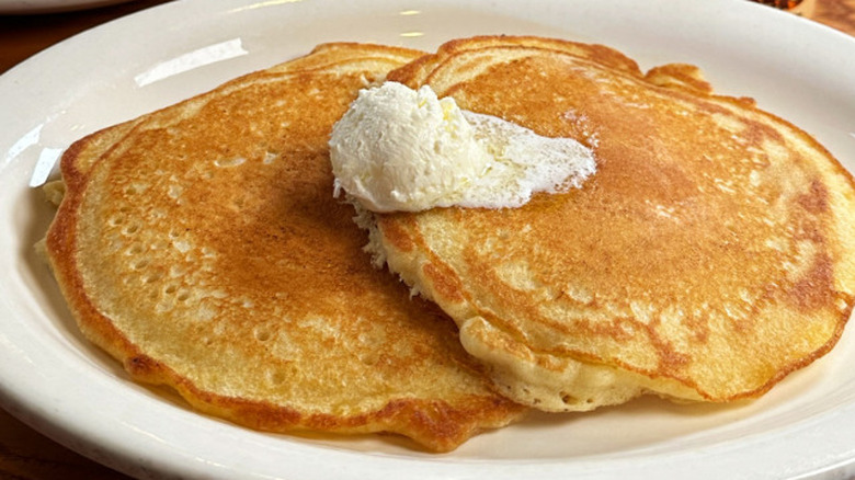 Cracker Barrel breakfast special on a table with pancakes and butter