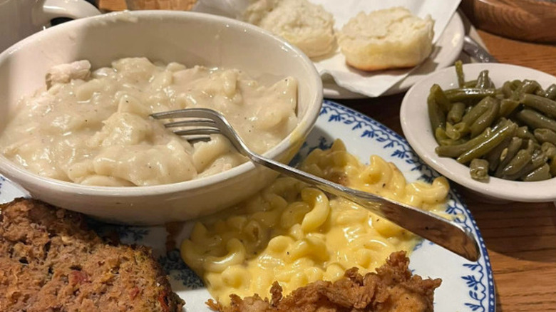Sampler platter with meatloaf, chicken, dumplings, mac and cheese, and green beans at Cracker Barrel