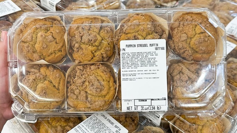 Hand holding package of Kirkland Signature pumpkin streusel muffins