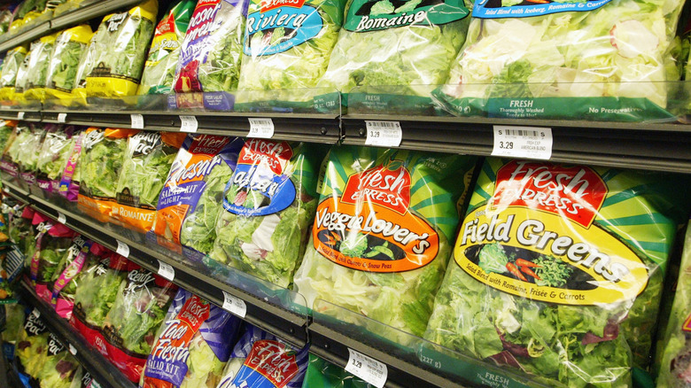 Bags of salad at grocery store