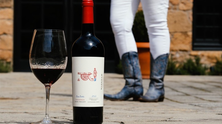 Bottle of Markham Winery Blue Boots Merlot and blue cowboy boots