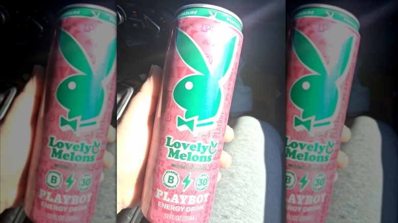 Hand holding can of Lovely Melons Playboy Energy Drink