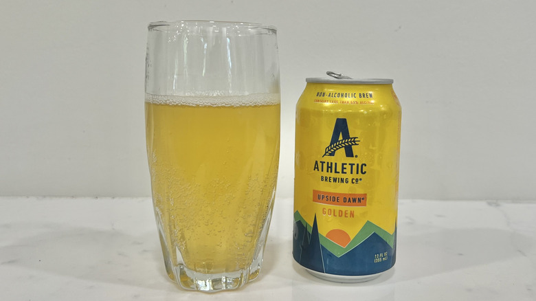 Athletic Brewing Co Upside Dawn Golden ale poured out into a glass.