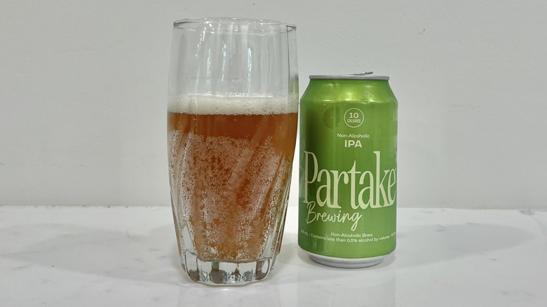 Partake Brewing IPA poured out into a glass.