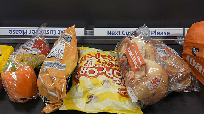 foods on conveyor belt at Aldi store