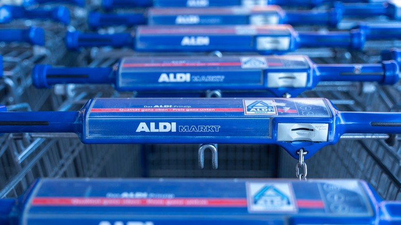 line of blue Aldi shopping carts