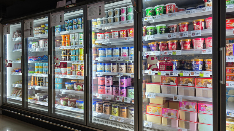 An assortment of frozen desserts in the freezer aisle of the grocery store