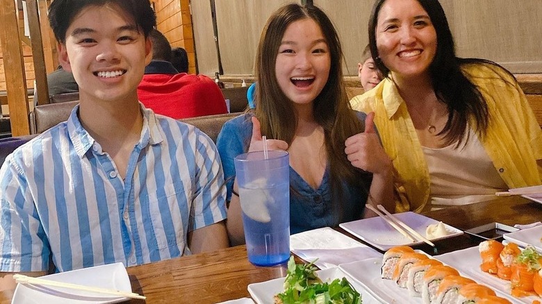 A family eating sushi in a restaurant