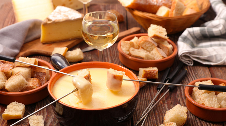 cheese fondue set up on table