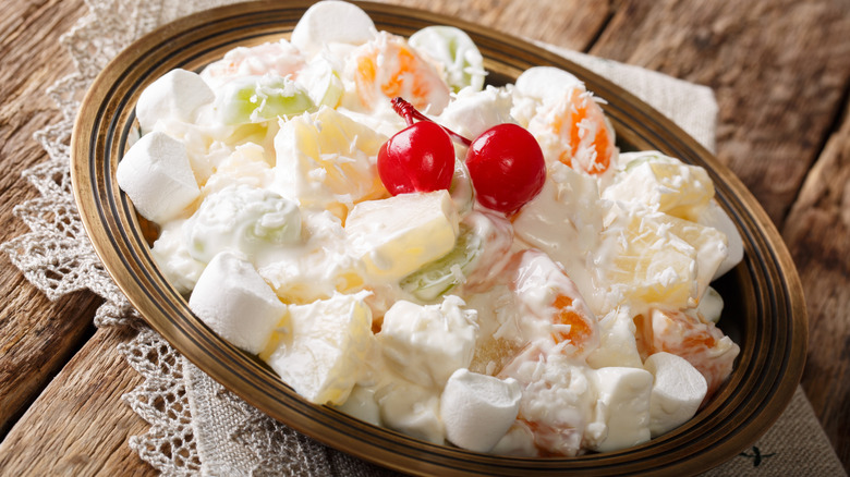 ambrosia salad in a dish on top of lace napkin