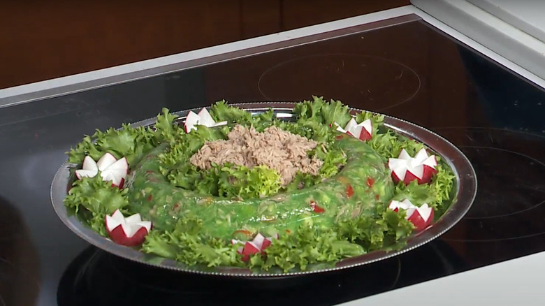 ring around the tuna salad on plate with lettuce and radishes