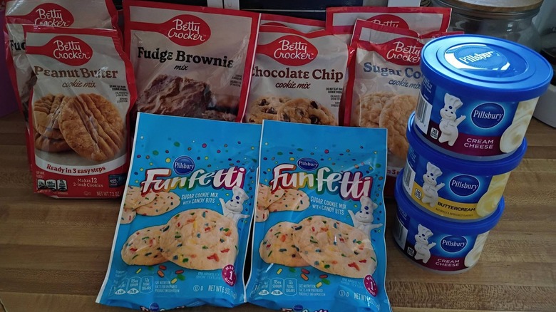 Variety of baking mixes and frostings from Dollar Tree on table