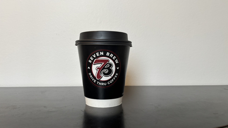 7 Brew coffee cup on black table