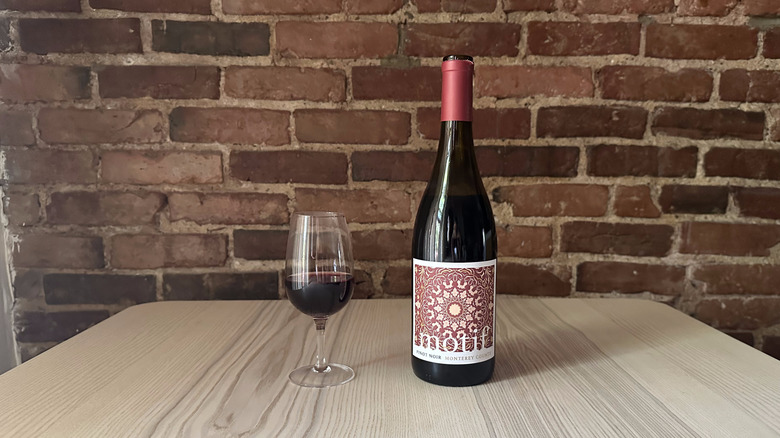 Bottle of Motif Pinot Noir on wooden table