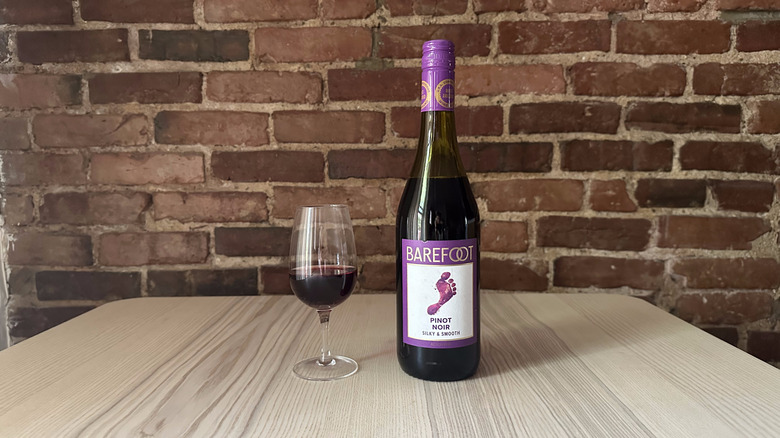 Bottle of Barefoot Pinot Noir on wooden table