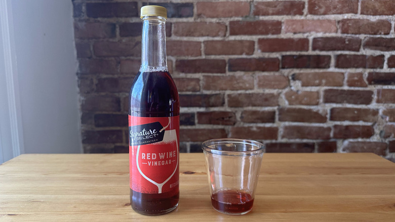 Signature Select Red Wine Vinegar on wooden table