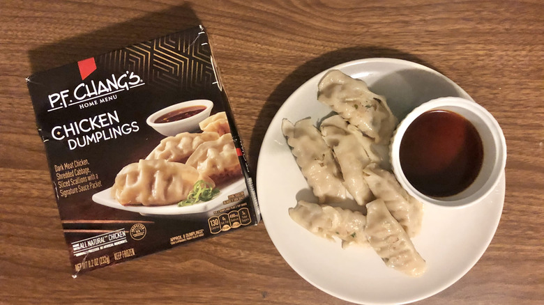 P.F. Chang's chicken dumplings on a plate next to the packaging