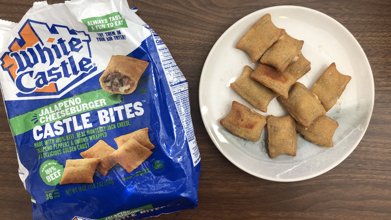 White Castle Jalapeño Cheeseburger Castle Bites on a plate next to the packaging