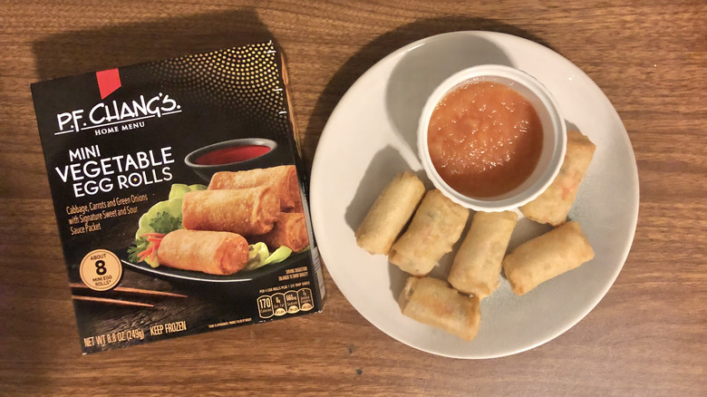 P.F. Chang's mini vegetable egg rolls on a plate next to the packaging