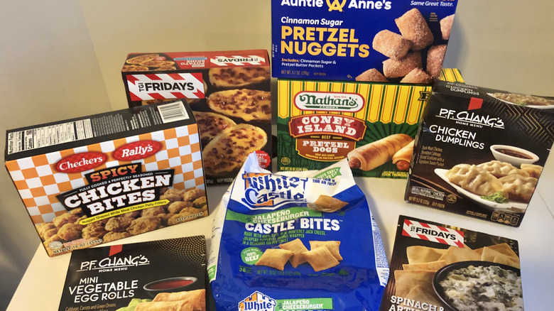 8 different restaurant chain frozen appetizers on a white countertop