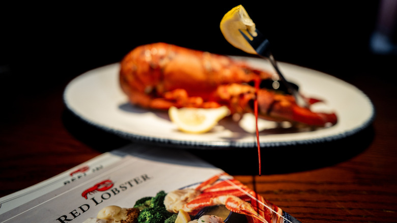 Red lobster menu and lobster on plate