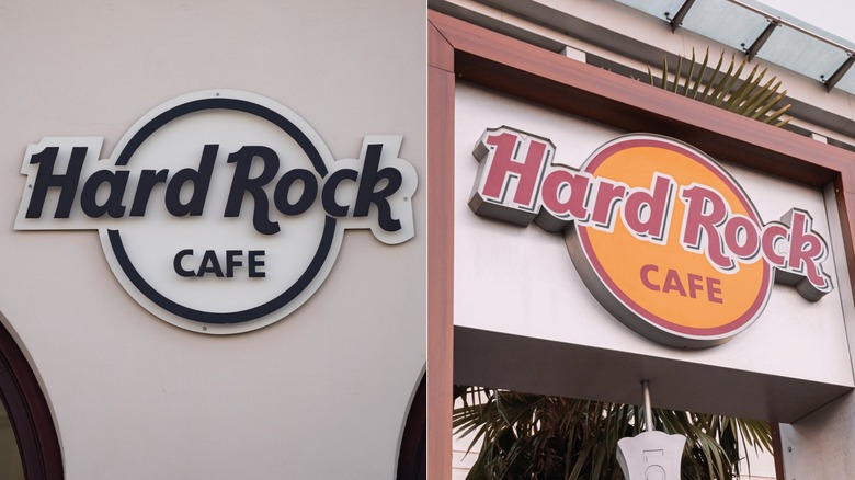 Hard Rock Cafe black and white sign on white building next to red and yellow Hard Rock Cafe sign on white signpost