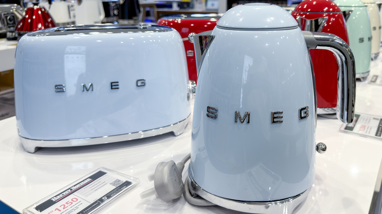 Powder blue Smeg toaster and electric kettle on white counter