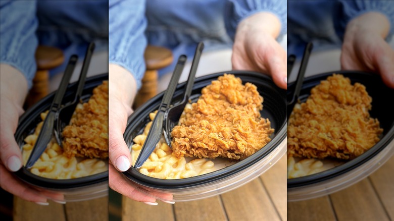 Mac and cheese and fried chicken in black to-go container