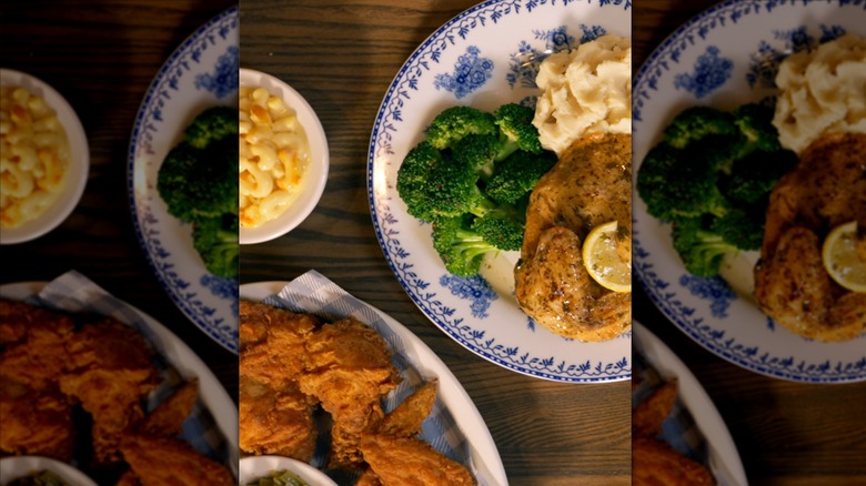 Fried chicken, mac and cheese, broccoli, and mashed potatoes on plates at Cracker Barrel
