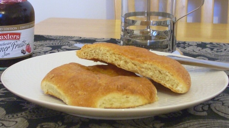 Two butteries on white plate