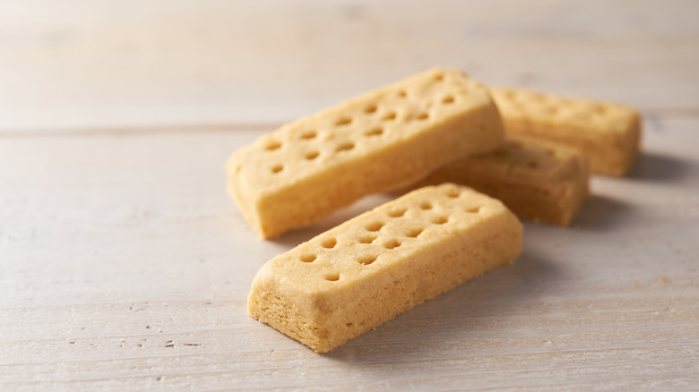 Four rectangles of shortbread on wooden table