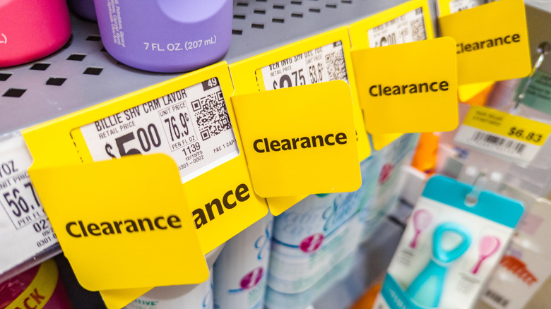 Clearance Signage Displayed On Walmart Store Shelf With Bright Yellow Price Tags
