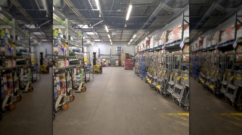 Mirrored image of the back room of a Walmart with shelves of stock and an aisle down the middle