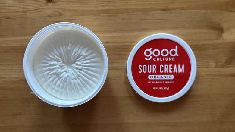 Good Culture Sour Cream on wooden table