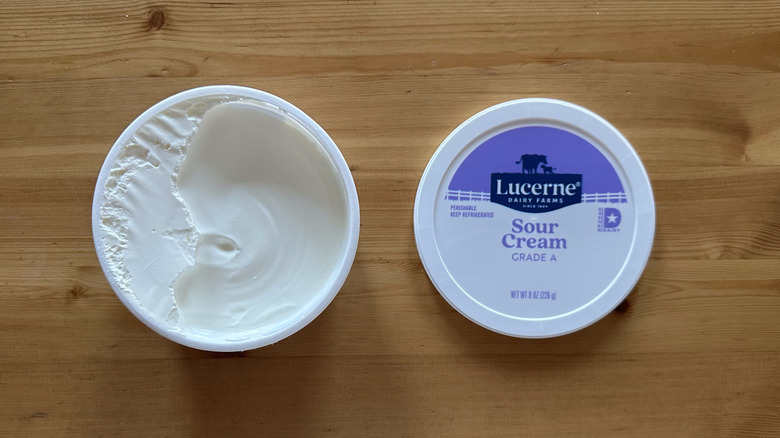 Lucerne Sour Cream on wooden table