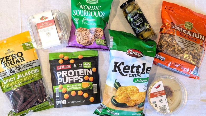 A variety of foods from Aldi arranged on a white tablecloth