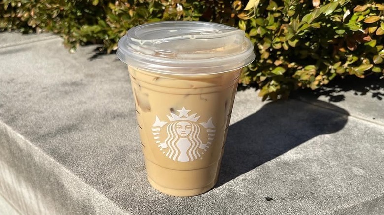 Starbucks Iced White Chocolate Mocha on concrete surface outdoors