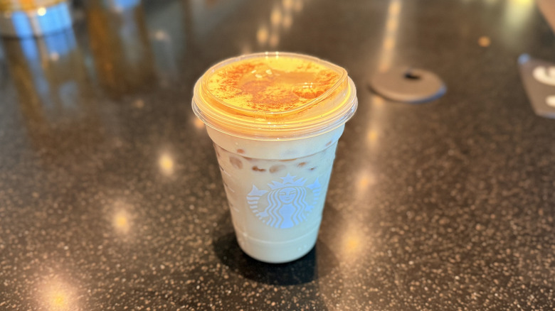 Starbucks Pumpkin Patch drink in a plastic cup on the counter