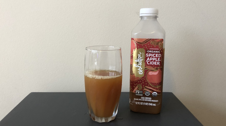 Evolution limited-edition organic spiced apple cider in a glass.
