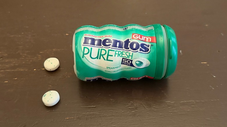 Mentos sugar free spearmint gum container on a table
