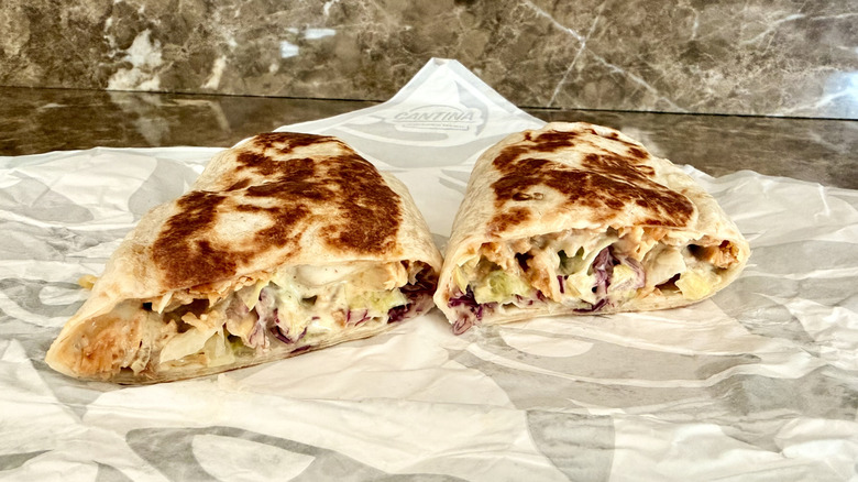 Taco Bell Cantina Chicken Burrito cut in half