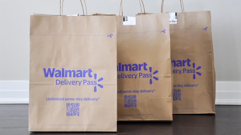 Paper Walmart delivery bags on wooden floor