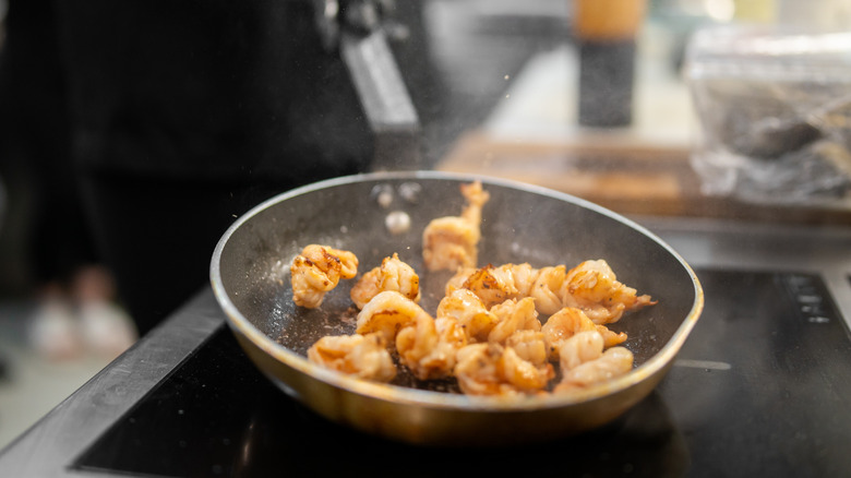 shrimp in saute pan on stovetop