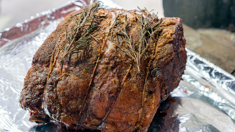 prime rib being seasoned
