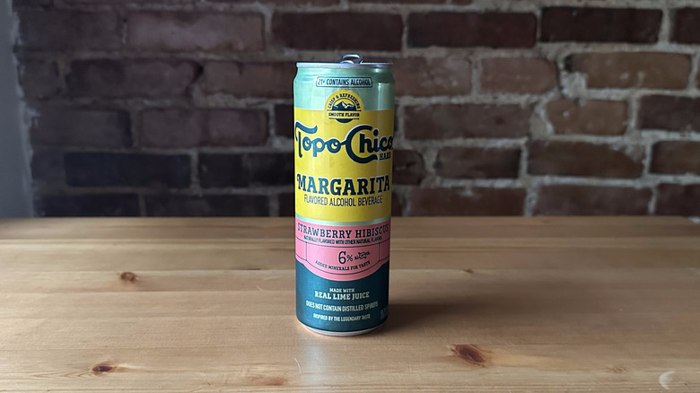 Topo Chico Strawberry Hibiscus Margarita on wooden table